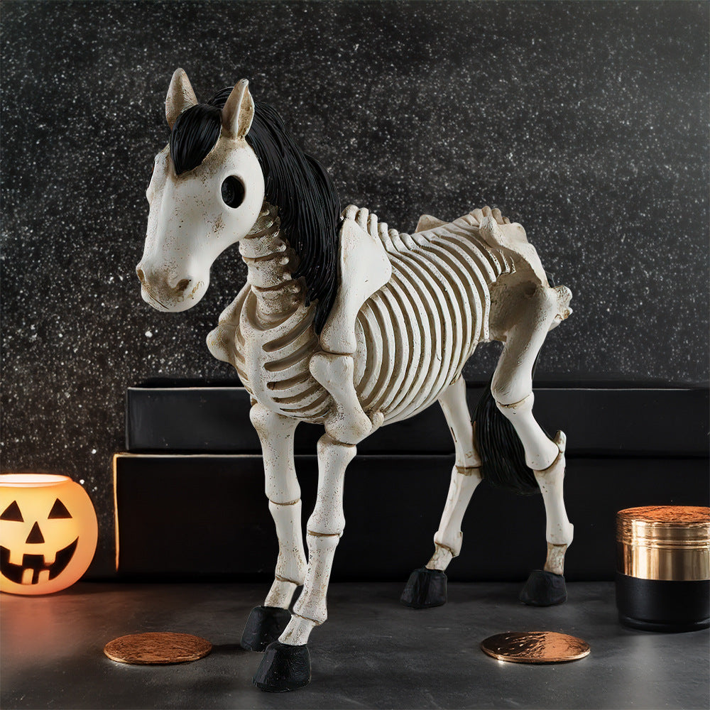 Halloween-themed horse skeleton figure with jack-o'-lantern and candles on a dark background