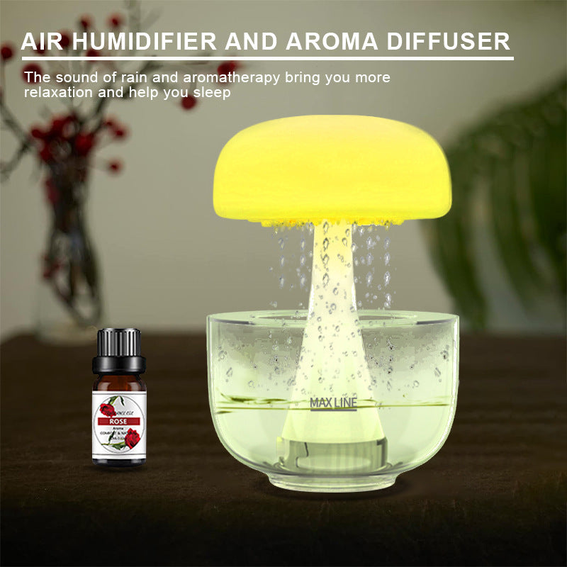 Yellow mushroom-shaped air humidifier and aroma diffuser with a bottle of essential oil on a blurred background.