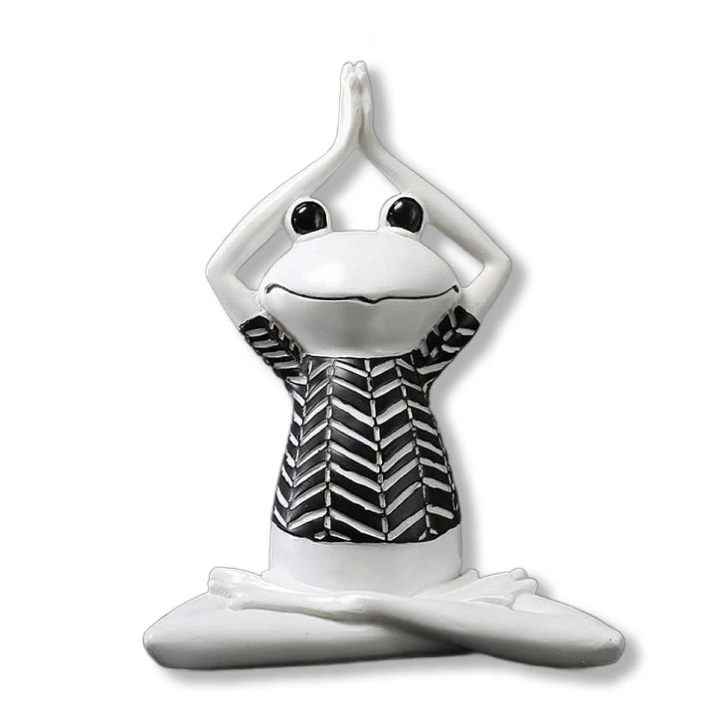 White ceramic frog figurine with black and white patterned shirt on a white background