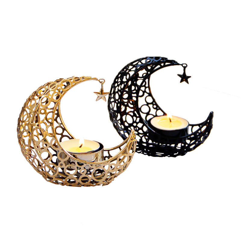 Two decorative candle holders shaped like moons with stars on a white background.