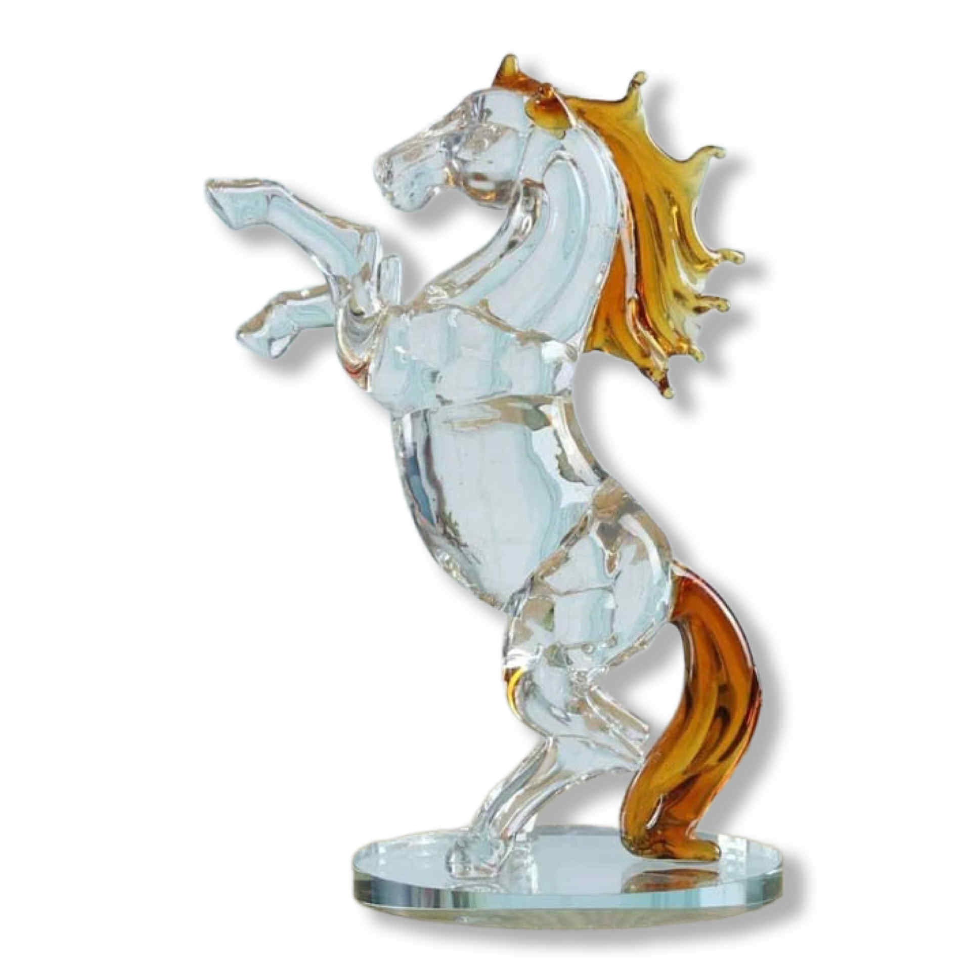 Glass figurine of a horse with gold accents on a white background