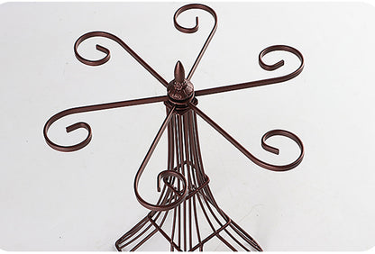 Decorative metal wall art with intricate designs on a white background