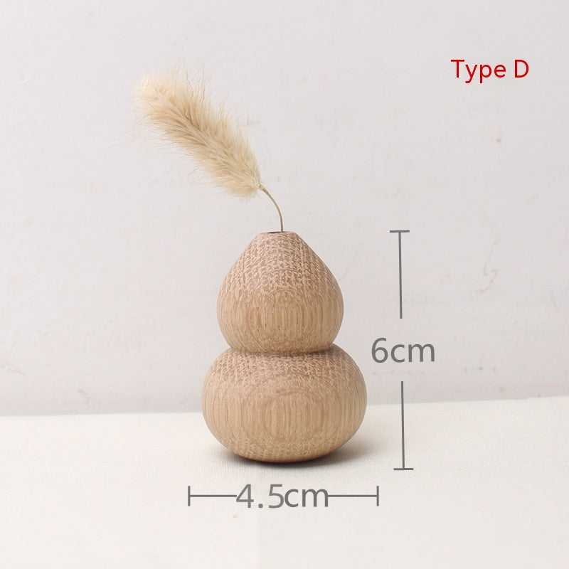 Decorative gourd with pampas grass and measurements on a white background