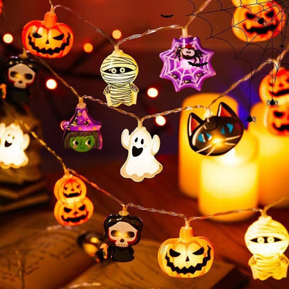 Halloween-themed string lights with various decorations on a dark background.