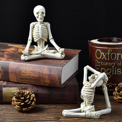 Two skeleton figurines on books with a 'Dictionary of English' book in the background.