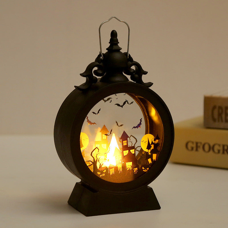 Halloween-themed lantern with a glowing interior scene on a neutral background