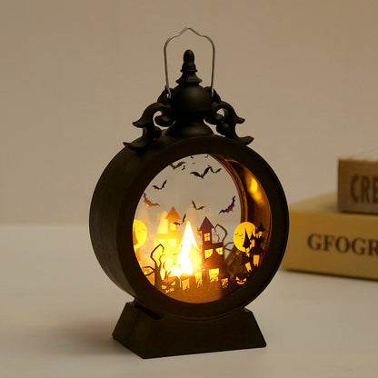 Halloween-themed lantern with a glowing interior scene on a neutral background