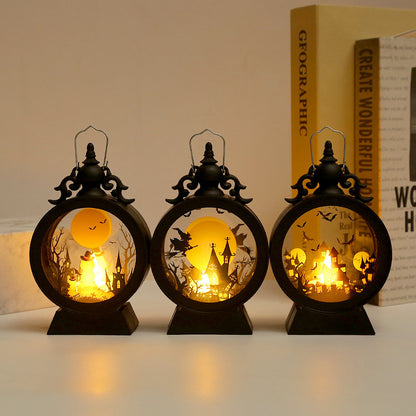 Three decorative lanterns with Halloween-themed cutouts on a plain background